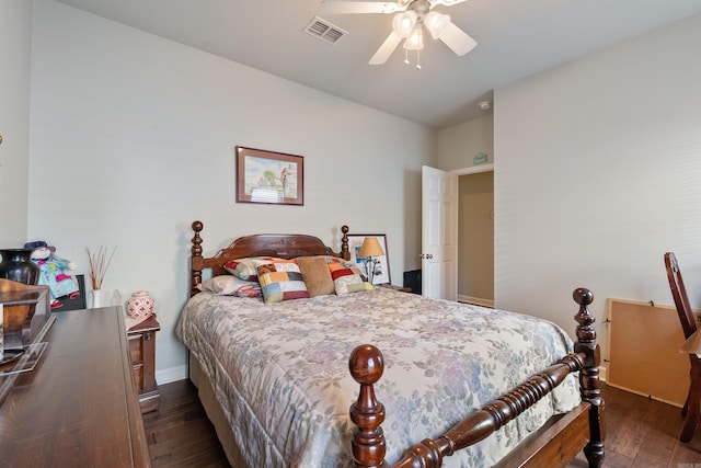 bedroom with hardwood / wood-style floors, a ceiling fan, and visible vents