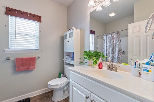 full bathroom featuring vanity, a shower with curtain, baseboards, tile patterned flooring, and toilet