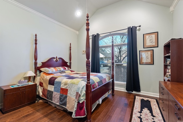 bedroom featuring baseboards, dark wood finished floors, crown molding, and vaulted ceiling