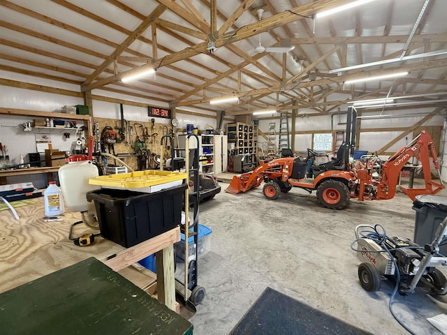 garage with a workshop area and metal wall