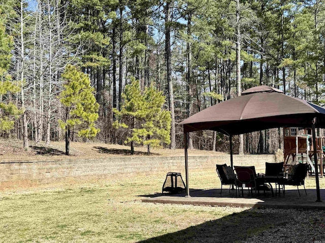 view of home's community featuring a patio and a lawn