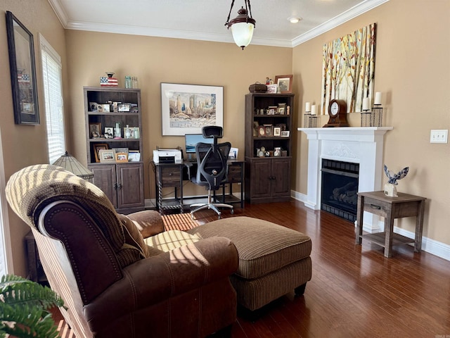 office featuring a fireplace, wood finished floors, baseboards, and ornamental molding