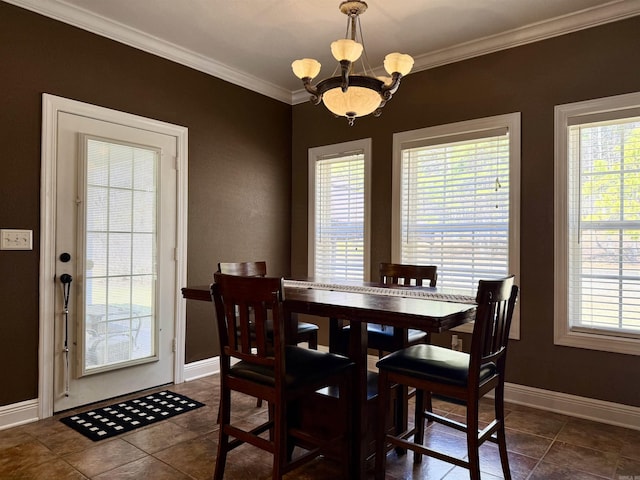 dining area featuring baseboards, plenty of natural light, a chandelier, and ornamental molding