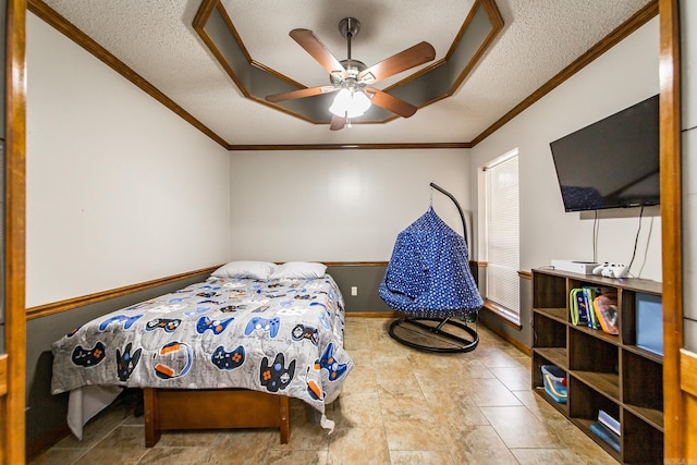 bedroom featuring a textured ceiling, baseboards, and ornamental molding