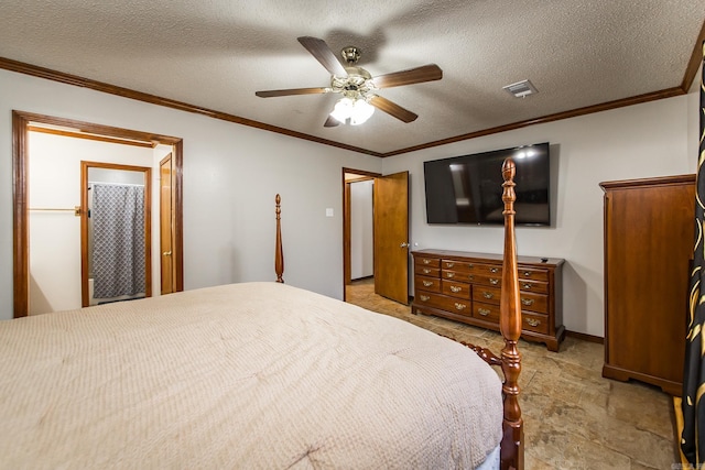 bedroom featuring a textured ceiling, visible vents, and ornamental molding