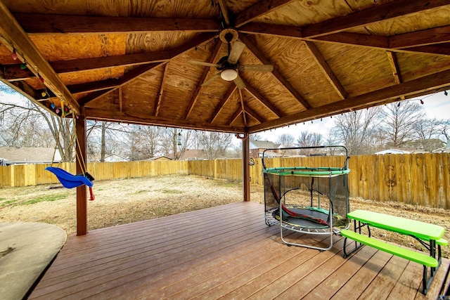 wooden terrace featuring a gazebo and a fenced backyard