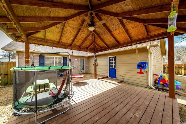 wooden deck with a gazebo and fence