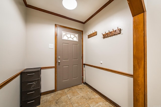 entryway with stone finish flooring and crown molding