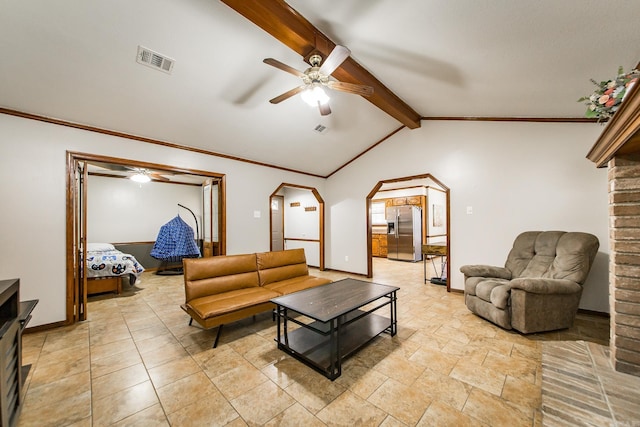 living area with visible vents, ornamental molding, arched walkways, baseboards, and vaulted ceiling with beams