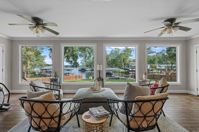 sunroom / solarium with a healthy amount of sunlight and ceiling fan