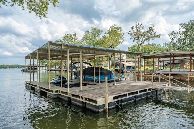 view of dock with a water view and boat lift