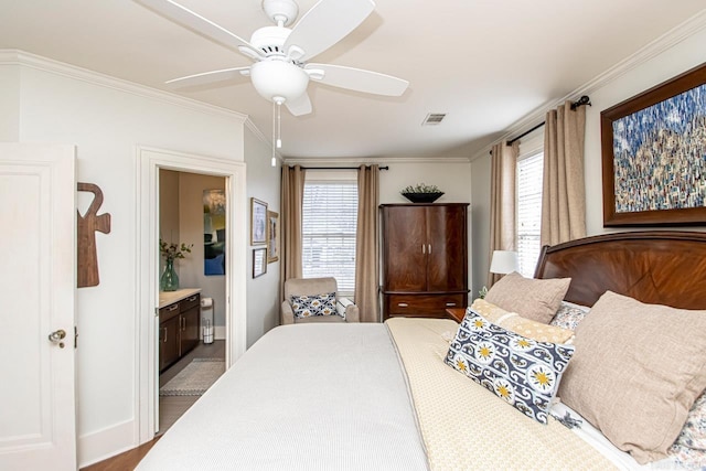 bedroom featuring visible vents, multiple windows, and crown molding