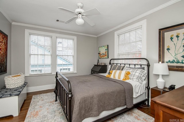 bedroom with ceiling fan, baseboards, ornamental molding, and dark wood-style flooring