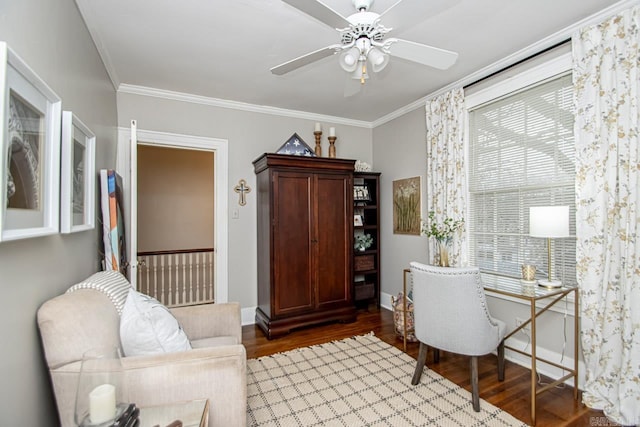 office featuring a ceiling fan, crown molding, wood finished floors, and baseboards