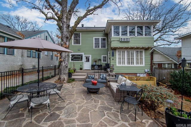 back of house with a patio, a deck, and fence