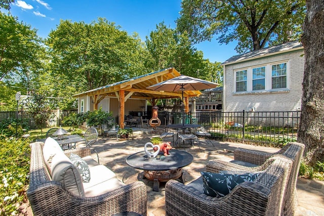 view of patio / terrace featuring outdoor lounge area, outdoor dining area, and fence