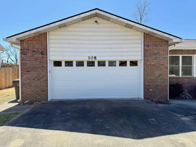 garage with fence