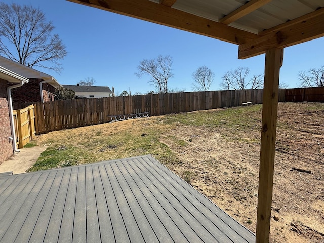 deck with a fenced backyard