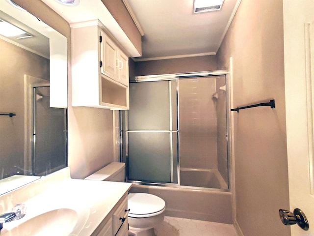 full bath with visible vents, bath / shower combo with glass door, toilet, ornamental molding, and vanity