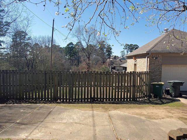 view of gate with fence