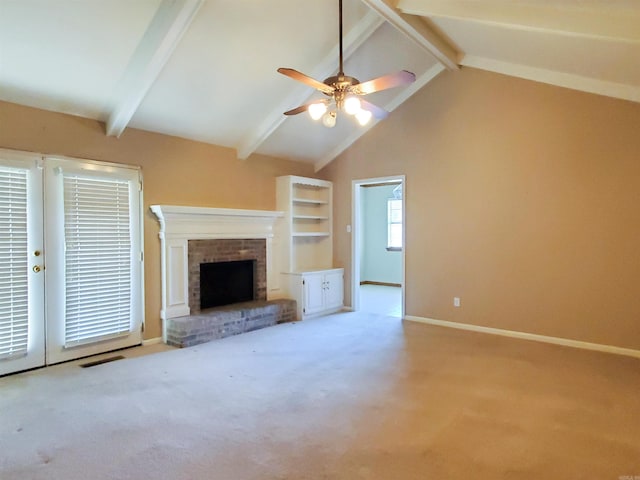 unfurnished living room with a ceiling fan, baseboards, lofted ceiling with beams, a brick fireplace, and carpet flooring