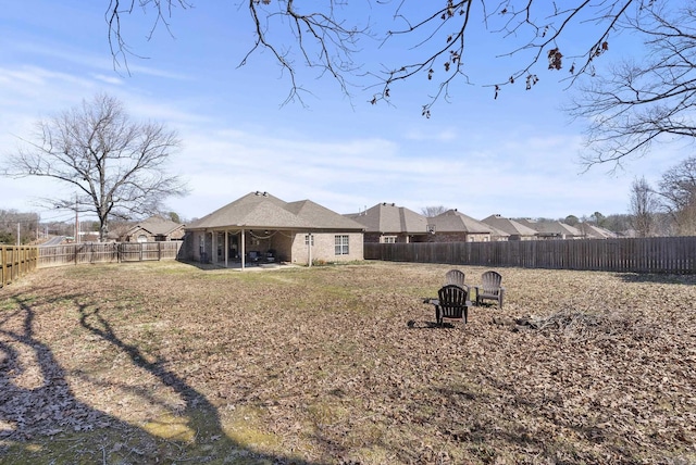 back of house featuring a patio and a fenced backyard