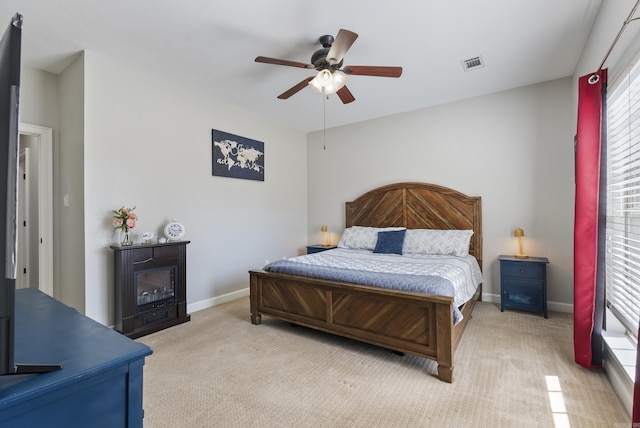 bedroom featuring visible vents, ceiling fan, baseboards, and carpet floors