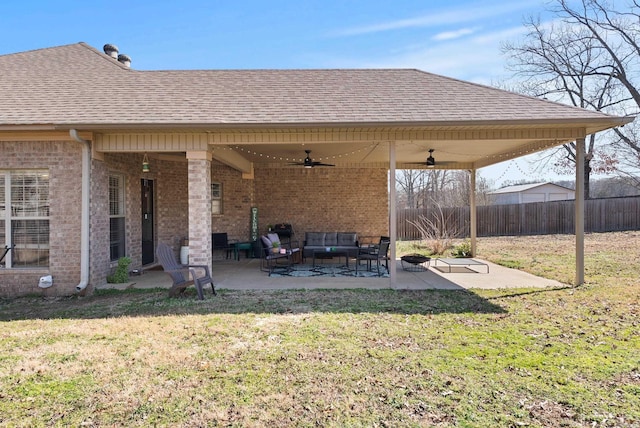 view of patio / terrace featuring outdoor lounge area, a ceiling fan, and fence