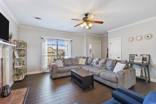 living area featuring dark wood finished floors, visible vents, and baseboards