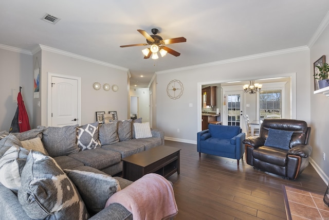 living room featuring visible vents, ornamental molding, baseboards, and wood finished floors