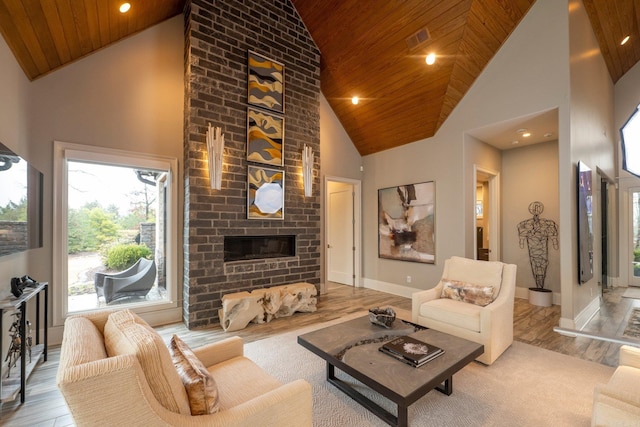 living area with visible vents, a brick fireplace, high vaulted ceiling, and wooden ceiling