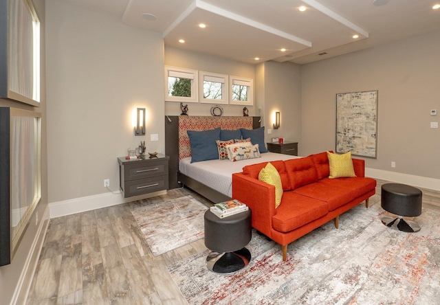 bedroom with recessed lighting, baseboards, and wood finished floors