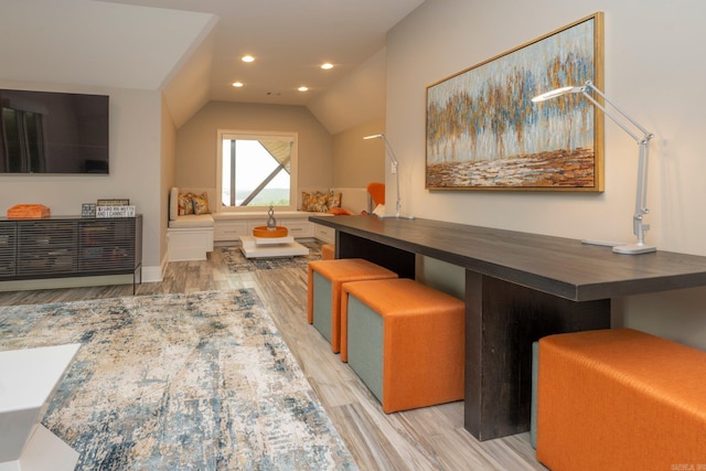 interior space with light wood finished floors, recessed lighting, and lofted ceiling