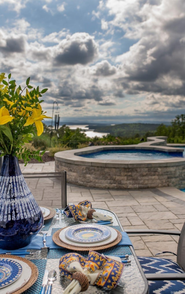 view of patio featuring a hot tub