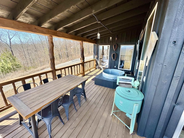 wooden deck featuring outdoor dining area