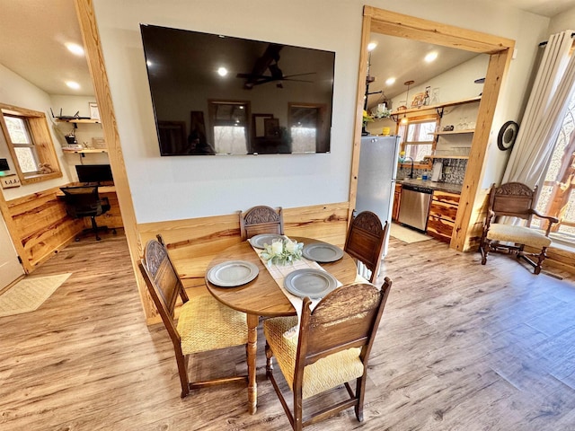 dining space featuring recessed lighting, light wood-style flooring, a ceiling fan, and built in study area