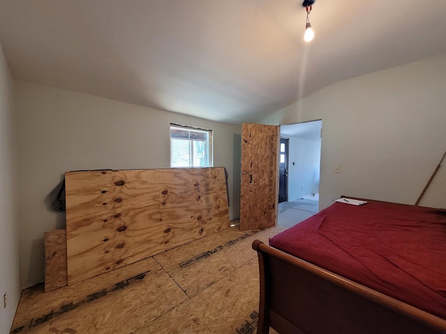 bedroom with lofted ceiling