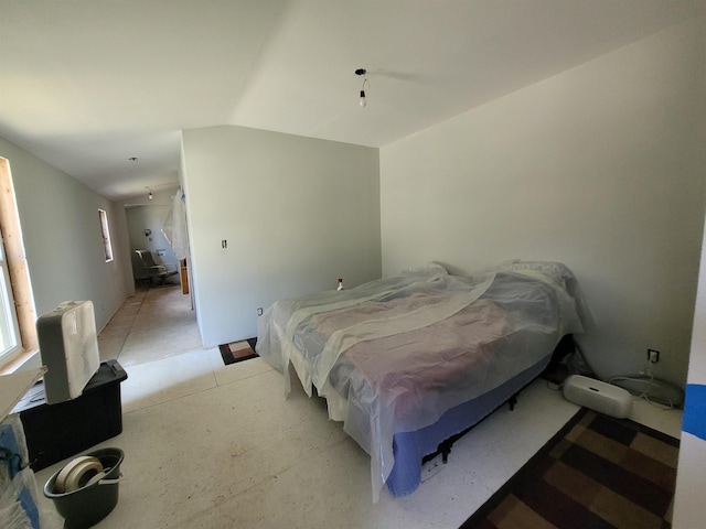 bedroom with vaulted ceiling