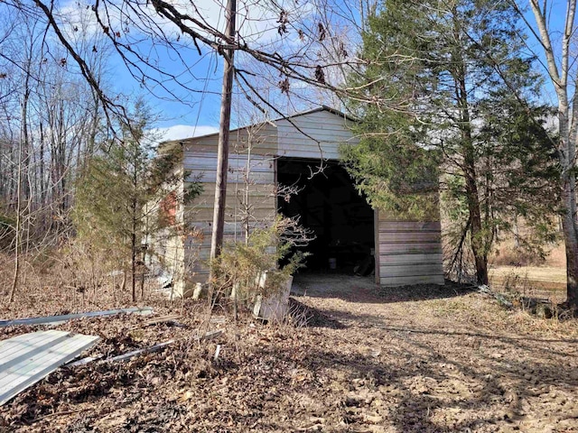 view of property exterior featuring an outdoor structure