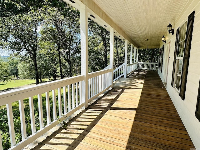 wooden terrace featuring covered porch