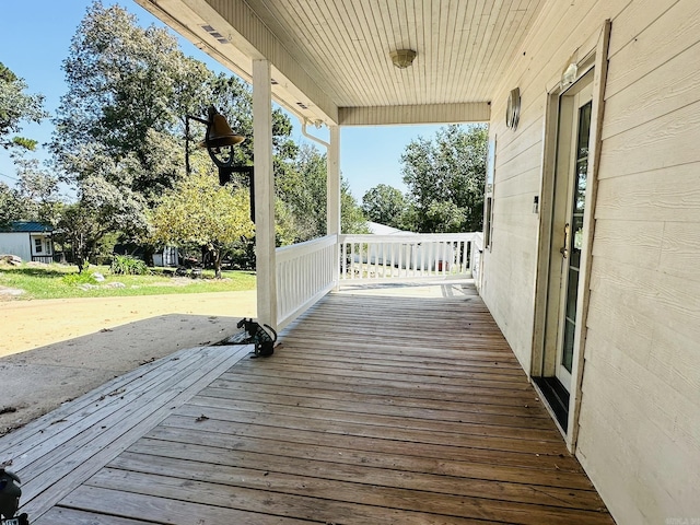 wooden terrace featuring covered porch