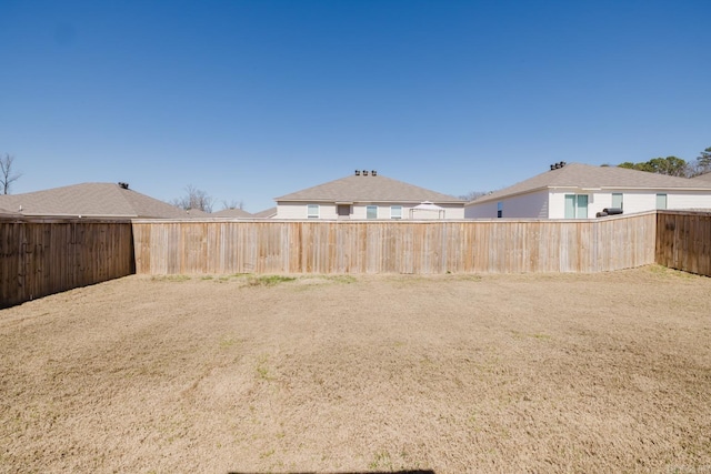 view of yard featuring a fenced backyard