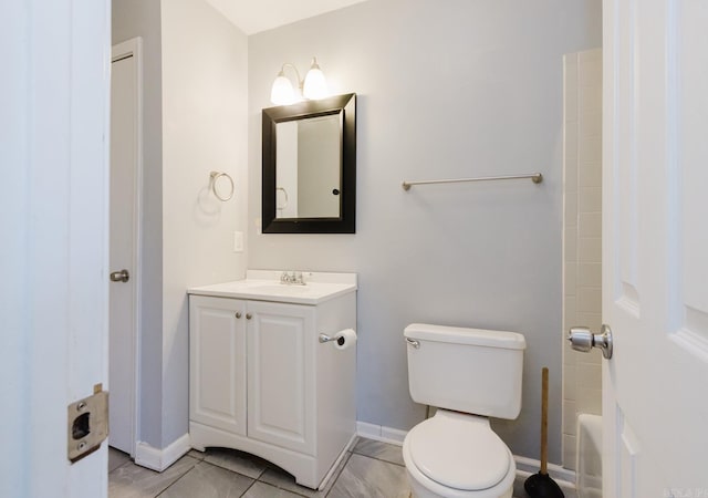 full bath with vanity, toilet, baseboards, and walk in shower