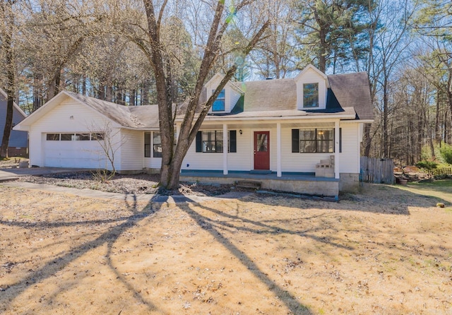 new england style home with a garage and covered porch