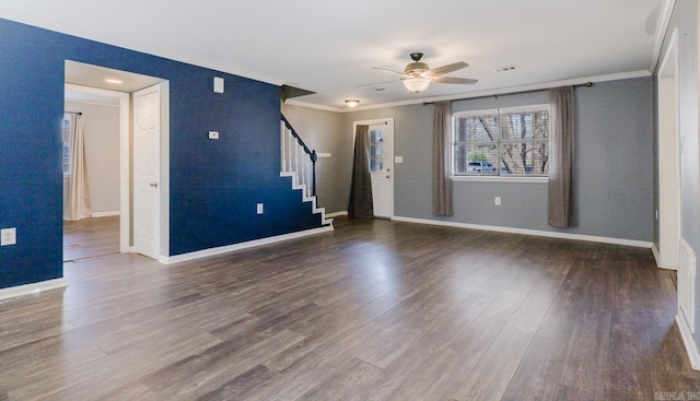 interior space featuring visible vents, baseboards, stairway, ornamental molding, and wood finished floors