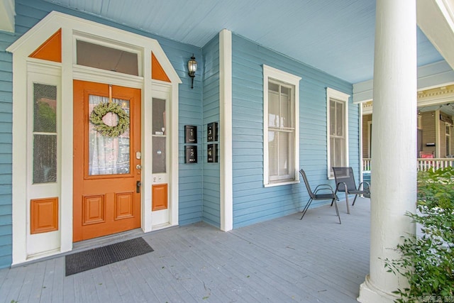 doorway to property featuring a porch