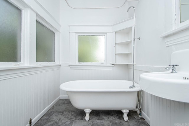 bathroom featuring a soaking tub