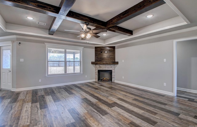 unfurnished living room with baseboards, beamed ceiling, a stone fireplace, dark wood-style floors, and coffered ceiling