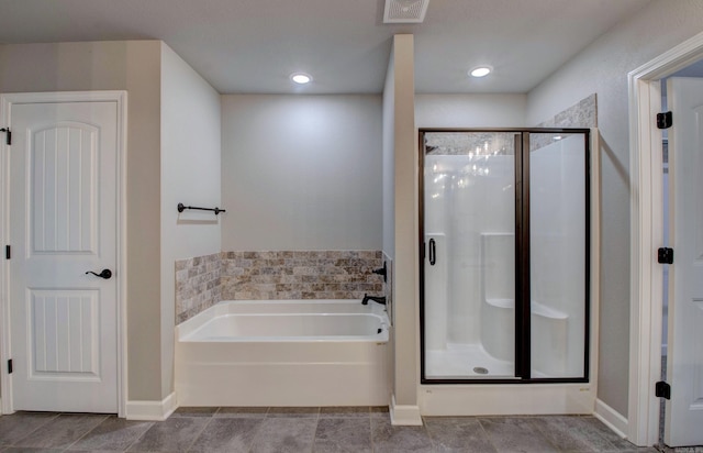 bathroom with a stall shower, visible vents, a bath, and tile patterned flooring