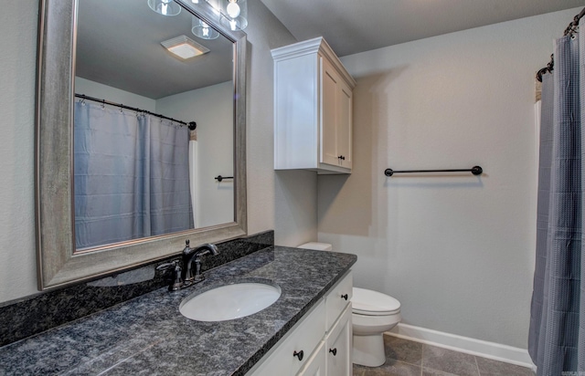 full bath with vanity, toilet, and baseboards